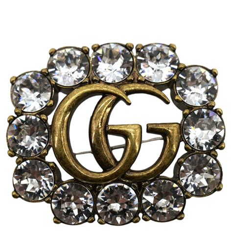 Metal Double G brooch with crystals 